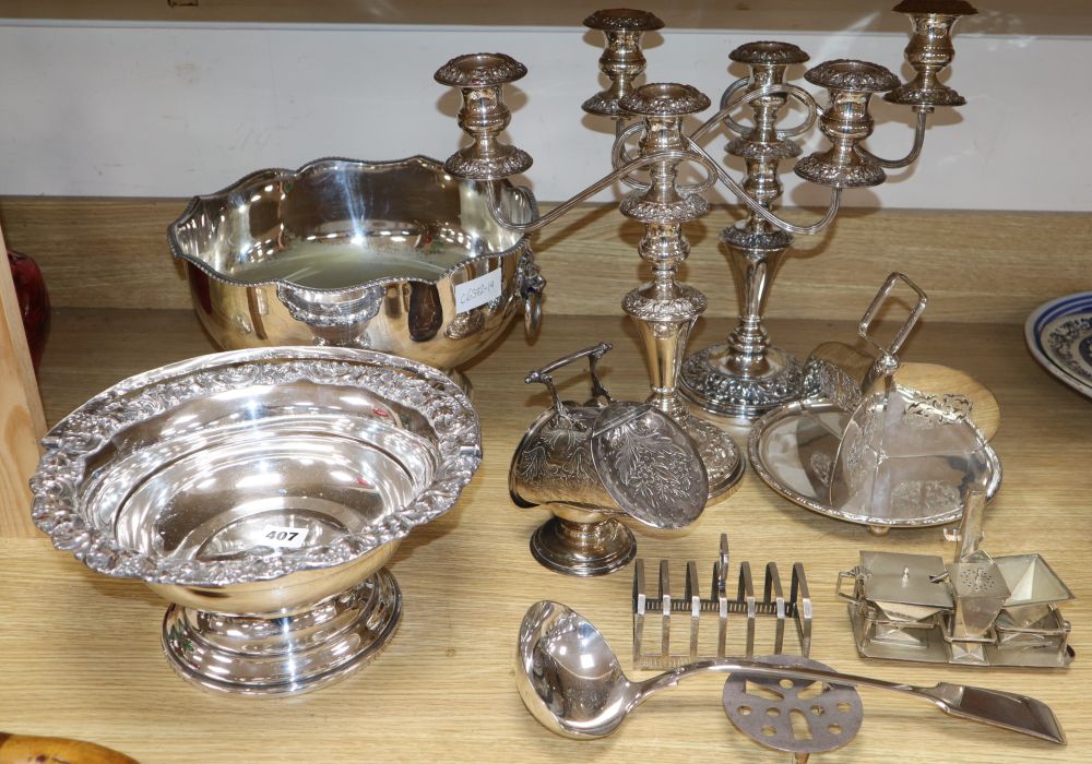 A collection of plated wares and a silver toastrack